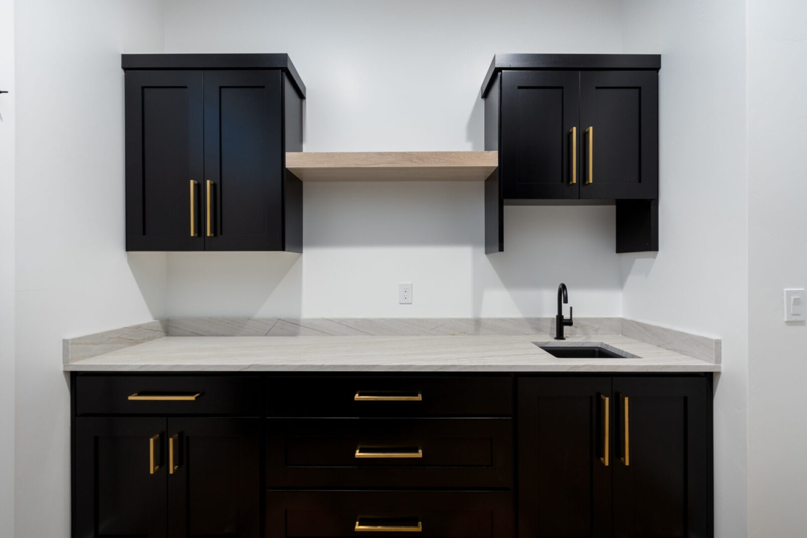 Black and gold-themed sink