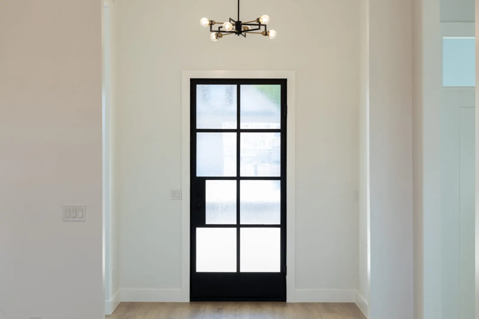 A black door with glass cover